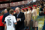 EMIRATES---FIFA-President-Sepp-Blatter-presenting-German-Captain-Phillip-Lahm-with-his-winners-medal